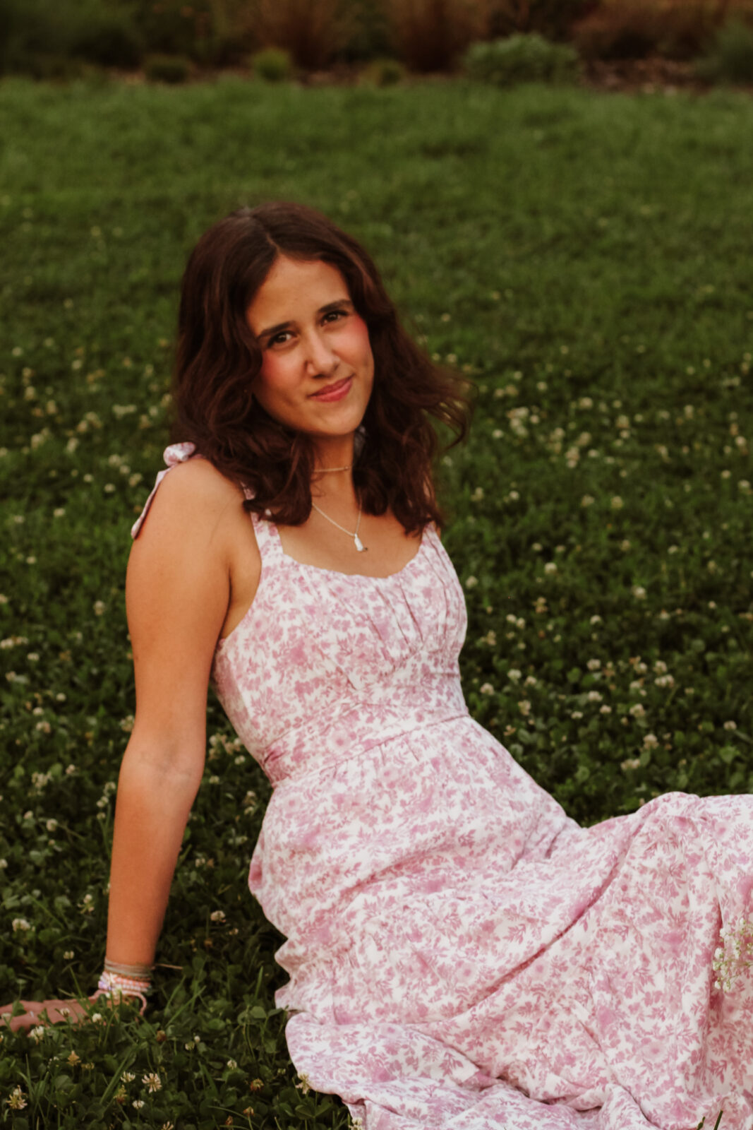 Photo of Iris Bastiaens sitting in a field of flowers