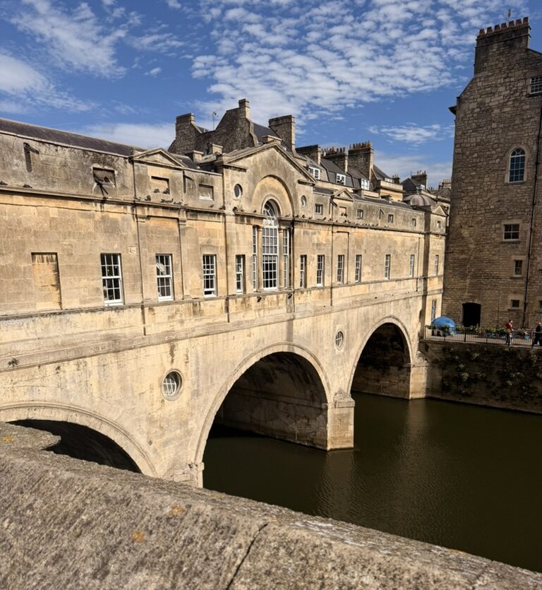 A brick bridge over a river in Bath