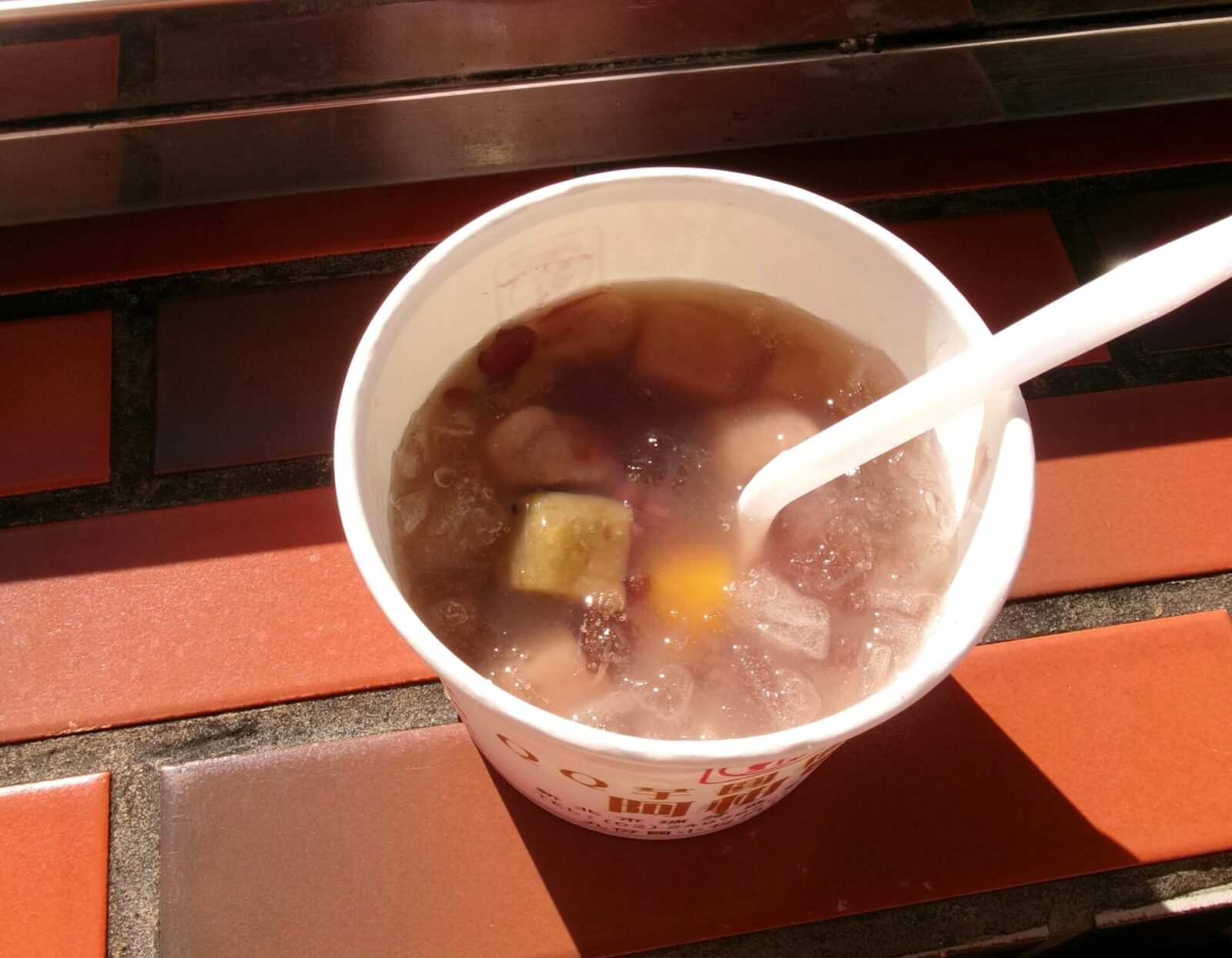 Cup of taro balls with spoon.